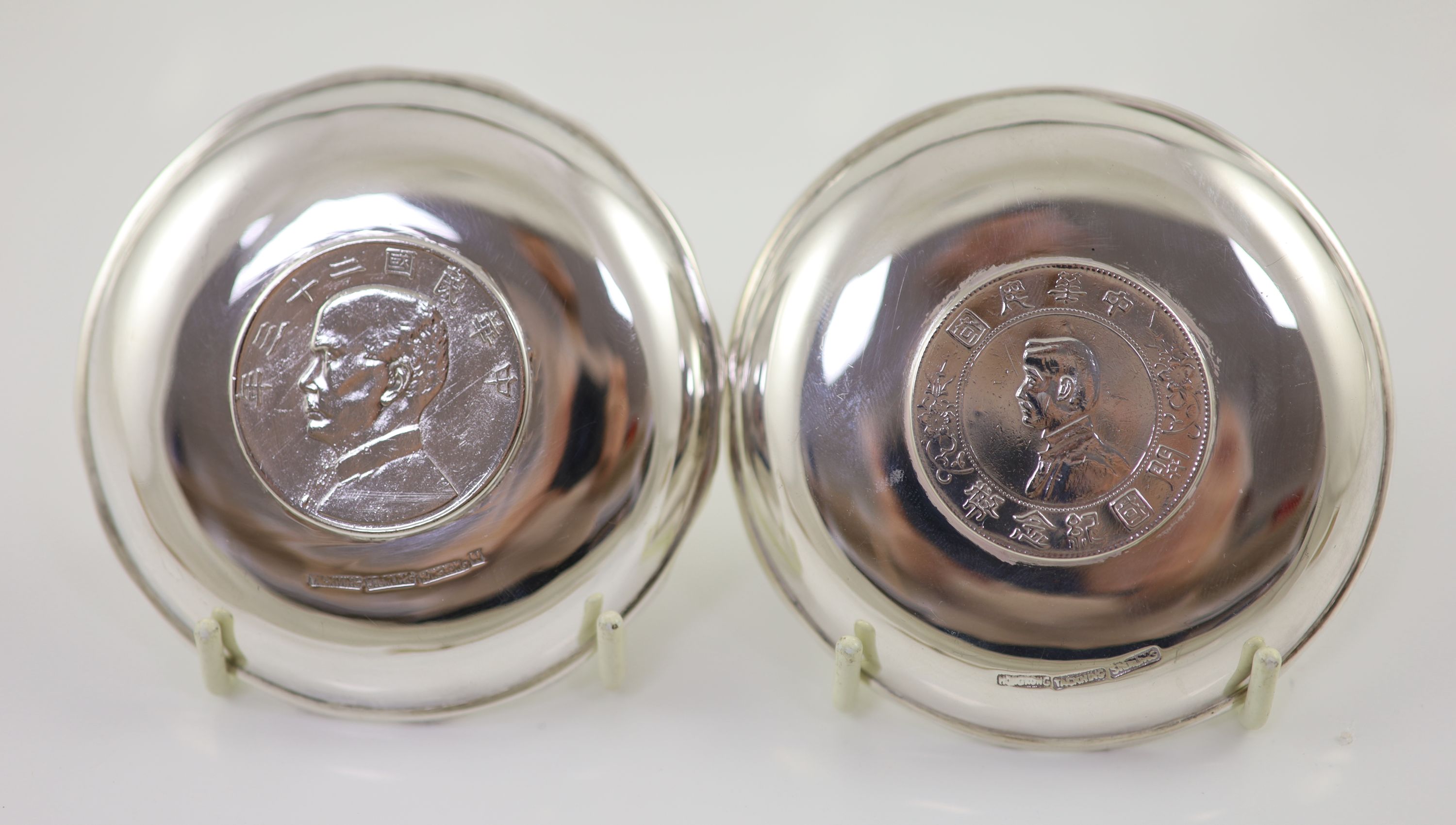Ten early 20th century Chinese Export small Sterling silver coin inset dishes with shaped 'bamboo' edges, by Tach Hing, Hong Kong,